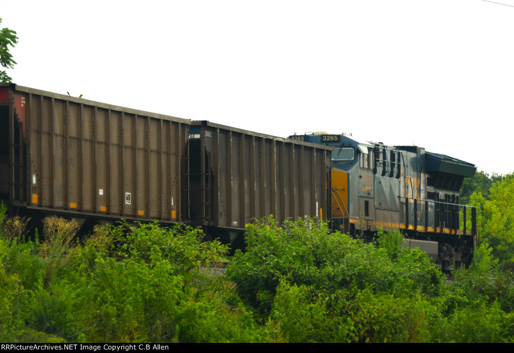 DPU For A SB Loaded Coal Train Waits In Mainline Traffic